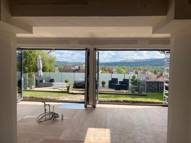 How much does it cost to knock down a load bearing wall? John ster